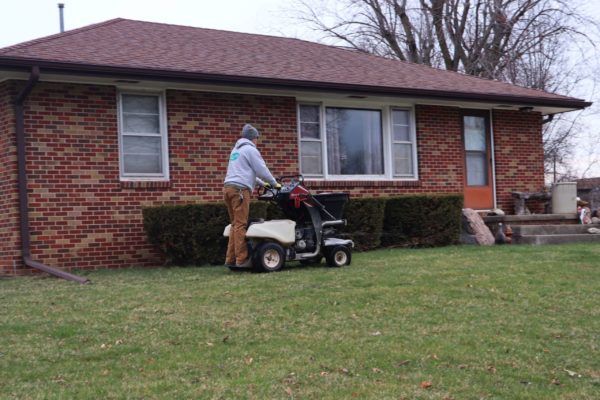 A PRO-Turf Services lawn care professional applies a first application of fertilizer as part of our 5 step lawn care program.