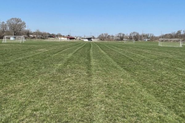 A sports field freshly seeded by PRO-TURF Services lawn and turf care.