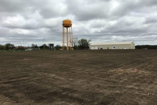 Winterset's practive football field undergoing the seeding process with PRO-TURF Services.