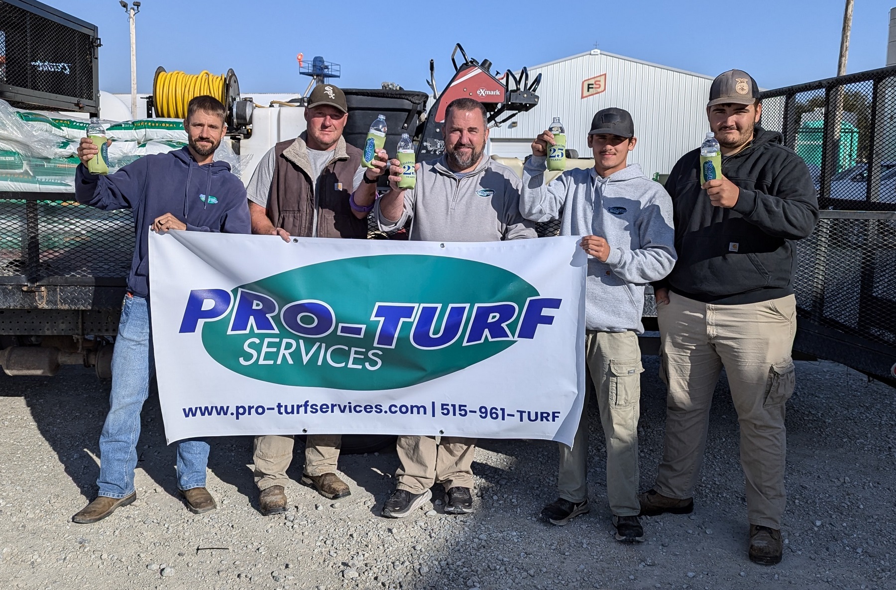 PRO-TURF Services team raising a toast to 25 years in business